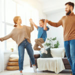 family playing with daughter